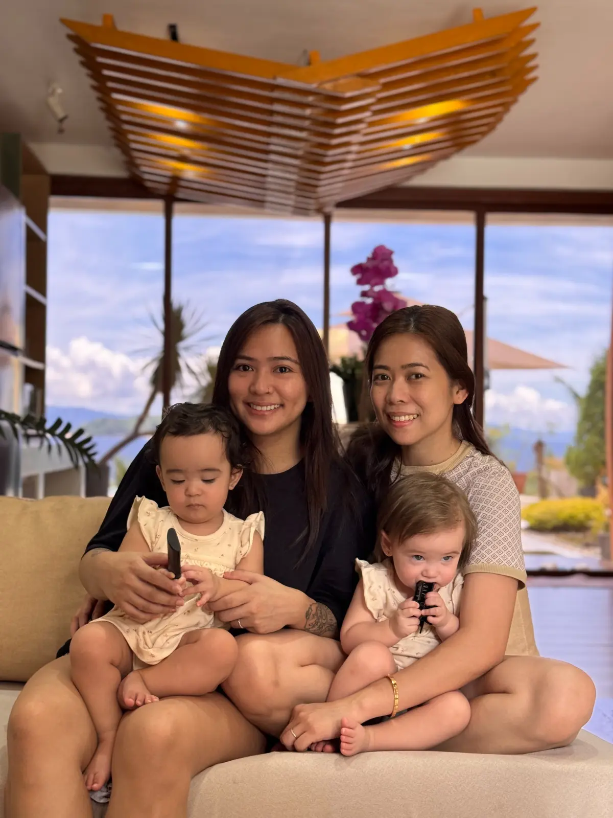 Anne and Vhen at home with the twins