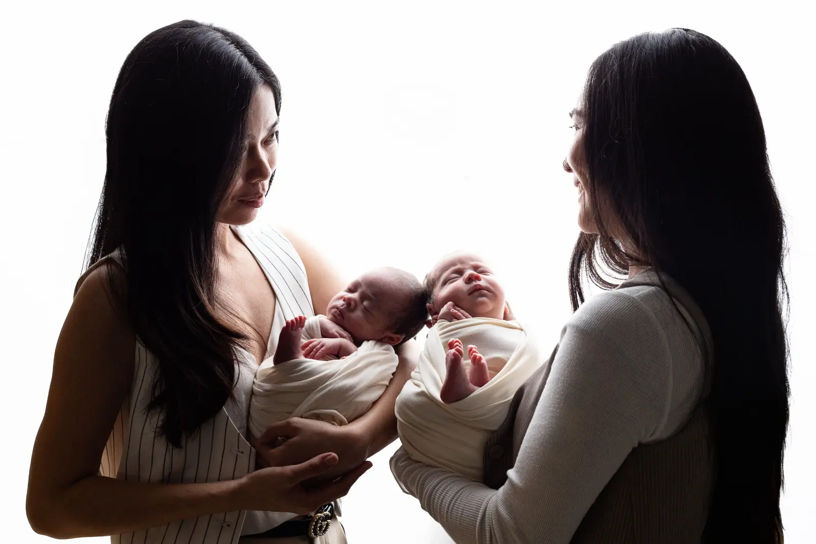 Anne and Vhen holding their newborn twins